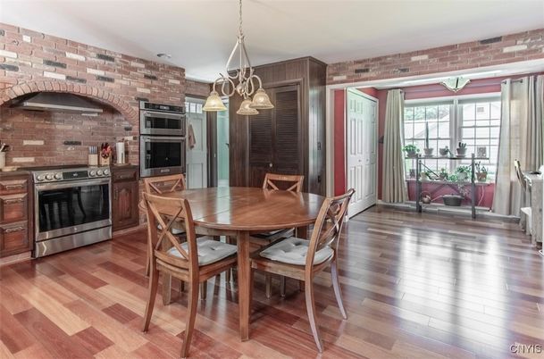 Dining room, Interior, Kitchen, Pendant Lights, Stainless Steel Appliances, Stone Walls, Wood Texture Flooring
