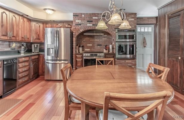 Dining room, Interior, Kitchen, Pendant Lights, Stainless Steel Appliances, Stone Walls, Wood Texture Flooring