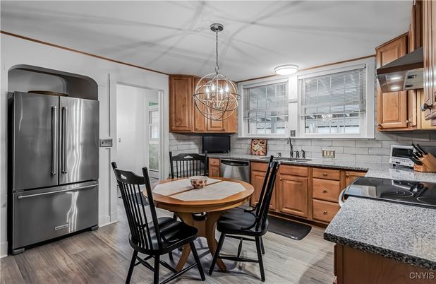 Chandelier, Dining room, Interior, Kitchen, Stainless Steel Appliances, Wood Texture Flooring