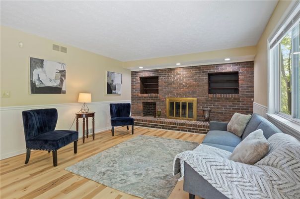 Fireplace, Interior, Living room, Recessed Lighting, Stone Walls, Wood Texture Flooring