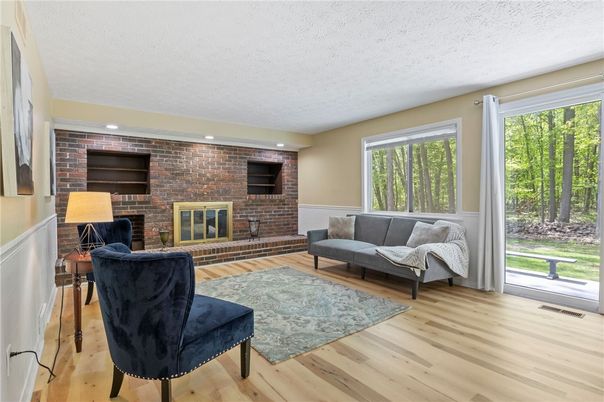 Fireplace, Interior, Living room, Recessed Lighting, Stone Walls, Wood Texture Flooring