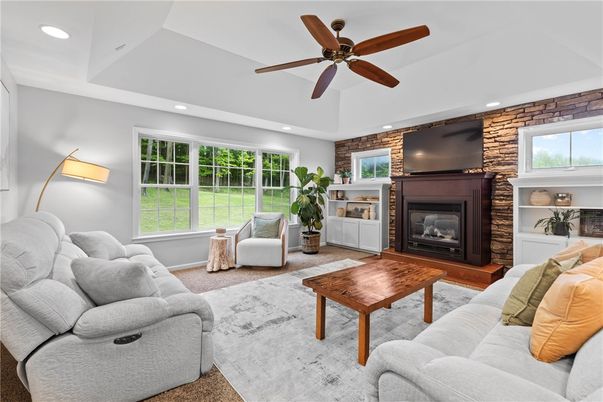 Fireplace, Interior, Living room, Recessed Lighting, Stone Walls, Wood Texture Flooring