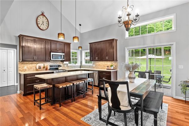 Chandelier, Dining room, Interior, Kitchen, Pendant Lights, Stainless Steel Appliances, Wood Texture Flooring
