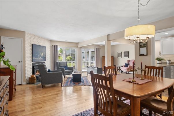 Chandelier, Dining room, Fireplace, Interior, Living room, Recessed Lighting, Wood Texture Flooring