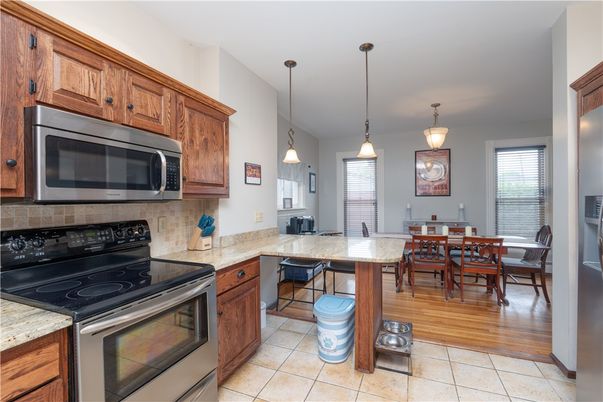 Dining room, Interior, Kitchen, Pendant Lights, Stainless Steel Appliances, Wood Texture Flooring