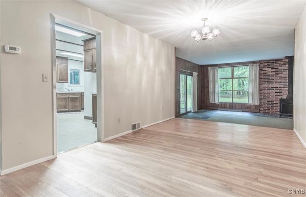 Chandelier, Empty room, Fireplace, Interior, Stone Walls, Wood Texture Flooring