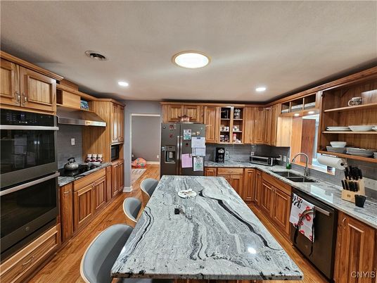 Dining room, Interior, Kitchen, Recessed Lighting, Stainless Steel Appliances, Wood Texture Flooring