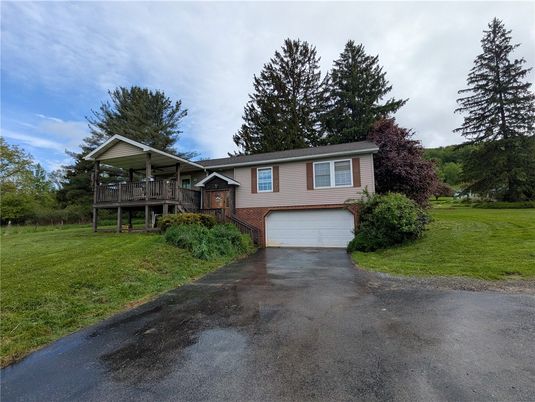 Attached, Backyard, Exterior, Facade, Brick Facade, Raised Ranch