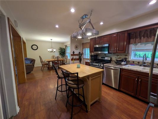 Chandelier, Dining room, Interior, Kitchen, Recessed Lighting, Stainless Steel Appliances, Wood Texture Flooring