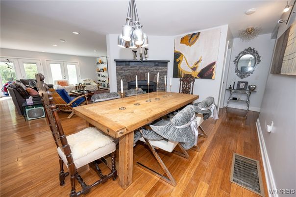 Dining room, Fireplace, Interior, Living room, Pendant Lights, Recessed Lighting, Wood Texture Flooring