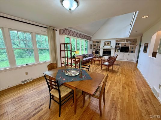 Dining room, Fireplace, Interior, Living room, Recessed Lighting, Wood Texture Flooring