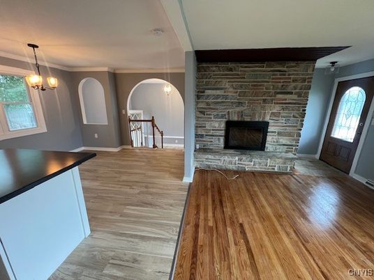 Empty room, Fireplace, Interior, Pendant Lights, Stone Walls, Wood Texture Flooring
