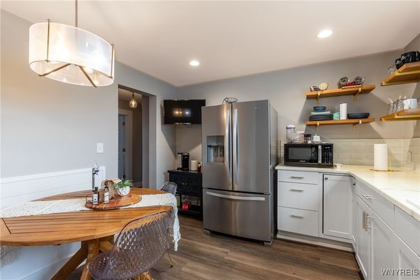 Dining room, Interior, Kitchen, Pendant Lights, Recessed Lighting, Stainless Steel Appliances, Wood Texture Flooring