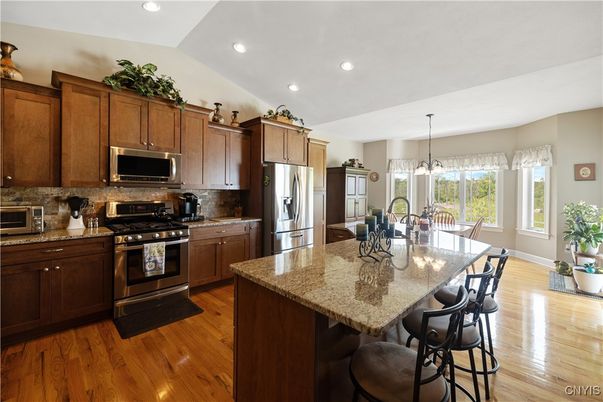 Dining room, Interior, Kitchen, Pendant Lights, Recessed Lighting, Stainless Steel Appliances, Wood Texture Flooring