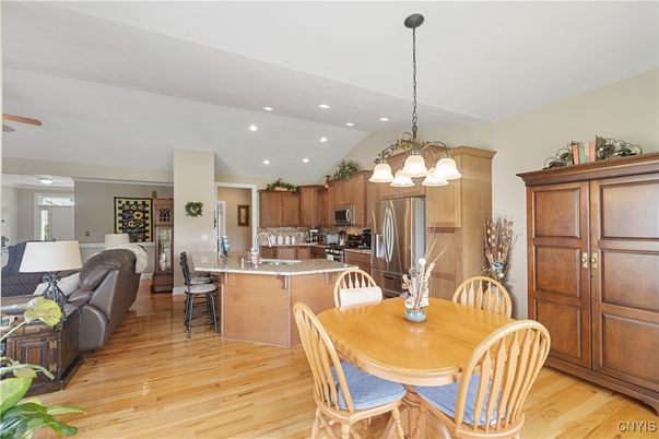 Chandelier, Dining room, Interior, Kitchen, Living room, Recessed Lighting, Stainless Steel Appliances, Wood Texture Flooring