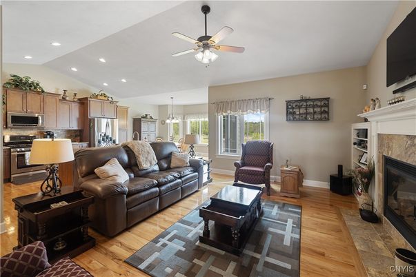 Dining room, Fireplace, Interior, Kitchen, Living room, Pendant Lights, Recessed Lighting, Stainless Steel Appliances, Wood Texture Flooring