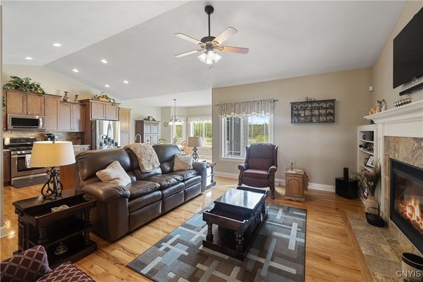 Dining room, Fireplace, Interior, Kitchen, Living room, Pendant Lights, Recessed Lighting, Stainless Steel Appliances, Wood Texture Flooring