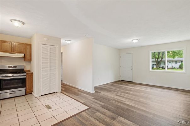 Empty room, Interior, Kitchen, Stainless Steel Appliances, Wood Texture Flooring
