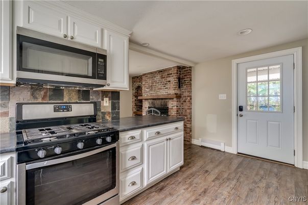 Fireplace, Interior, Kitchen, Recessed Lighting, Stone Walls, Wood Texture Flooring