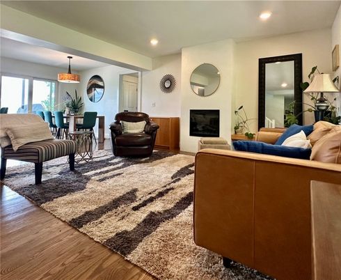 Dining room, Fireplace, Interior, Living room, Pendant Lights, Recessed Lighting, Wood Texture Flooring