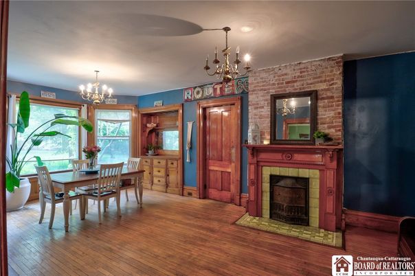 Chandelier, Dining room, Fireplace, Interior, Stone Walls, Wood Texture Flooring