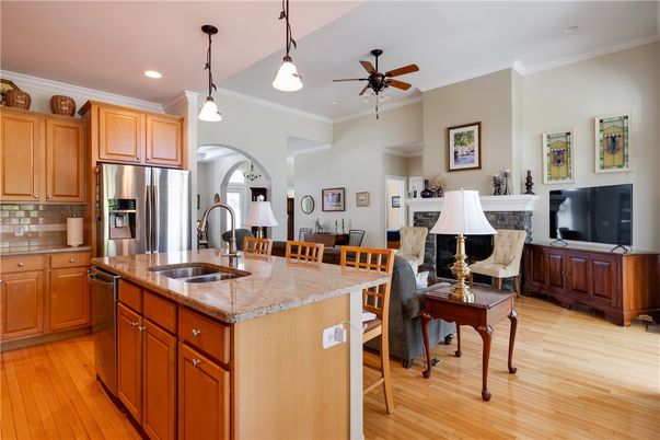 Dining room, Fireplace, Interior, Kitchen, Living room, Pendant Lights, Recessed Lighting, Stainless Steel Appliances, Wood Texture Flooring