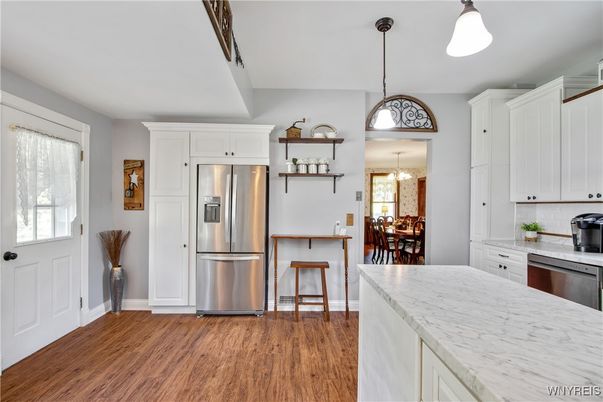 Chandelier, Dining room, Interior, Kitchen, Pendant Lights, Stainless Steel Appliances, Wood Texture Flooring