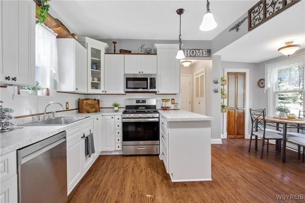 Dining room, Interior, Kitchen, Pendant Lights, Stainless Steel Appliances, Wood Texture Flooring