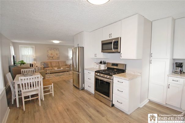 Dining room, Interior, Kitchen, Living room, Stainless Steel Appliances, Wood Texture Flooring