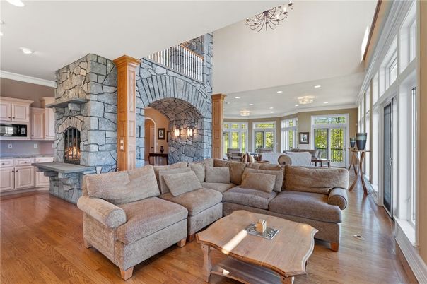 Dining room, Fireplace, Interior, Kitchen, Living room, Recessed Lighting, Stone Walls, Wood Texture Flooring