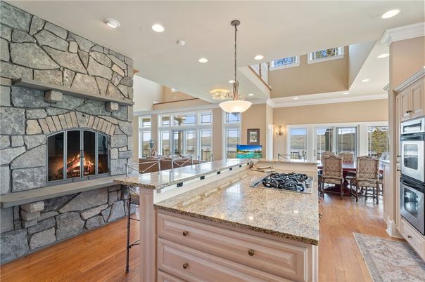Dining room, Fireplace, Interior, Kitchen, Pendant Lights, Recessed Lighting, Stone Walls, Wood Texture Flooring