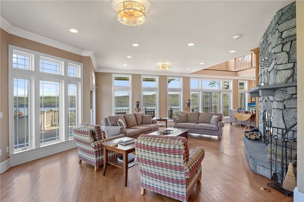 Fireplace, Interior, Living room, Recessed Lighting, Stone Walls, Wood Texture Flooring