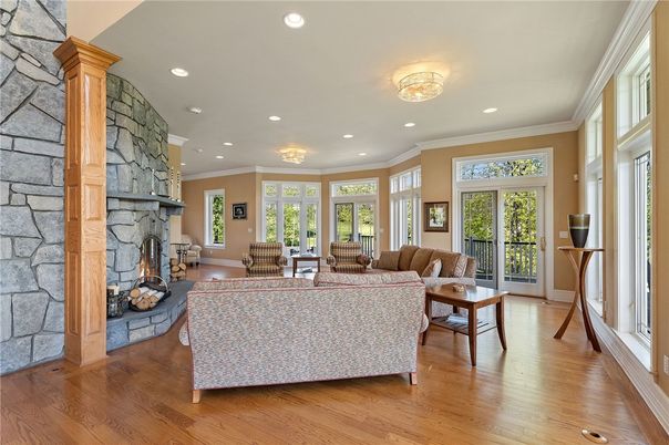 Fireplace, Interior, Living room, Recessed Lighting, Stone Walls, Wood Texture Flooring