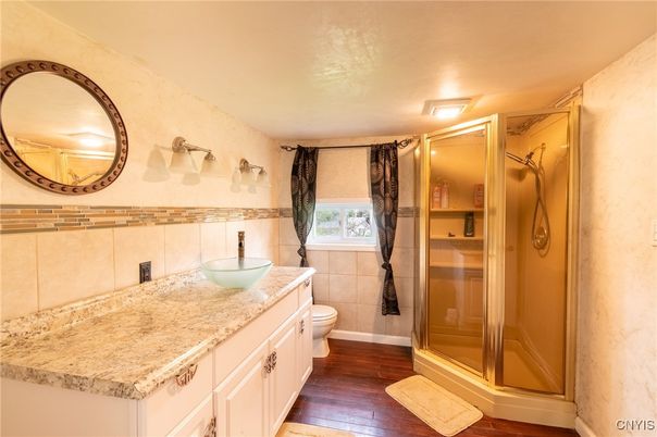 Bathroom, Dual Sink Vanities, Glass Shower, Interior, Wood Texture Flooring
