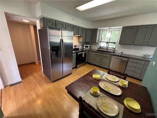 Dining room, Interior, Kitchen, Recessed Lighting, Stainless Steel Appliances, Wood Texture Flooring