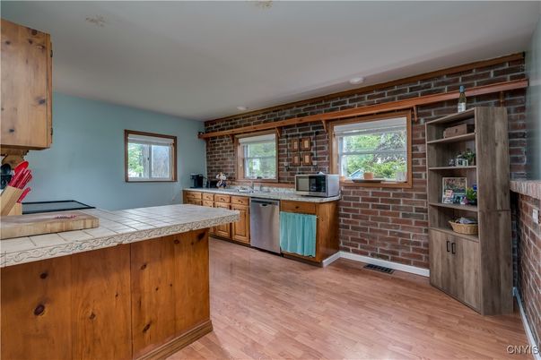 Interior, Kitchen, Stone Walls, Tile Countertops, Wood Texture Flooring