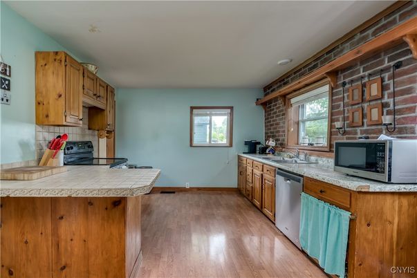 Interior, Kitchen, Stone Walls, Tile Countertops, Wood Texture Flooring