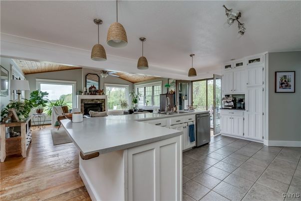 Fireplace, Interior, Kitchen, Pendant Lights, Stainless Steel Appliances, Wood Texture Flooring
