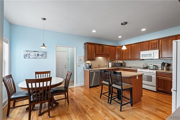 Dining room, Interior, Kitchen, Pendant Lights, Recessed Lighting, Stainless Steel Appliances, Wood Texture Flooring