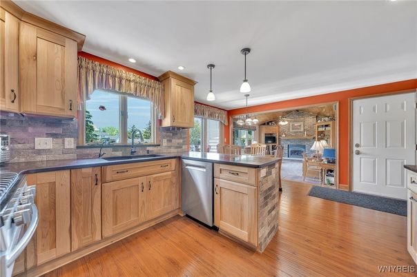 Fireplace, Interior, Kitchen, Pendant Lights, Recessed Lighting, Stone Walls, Wood Texture Flooring