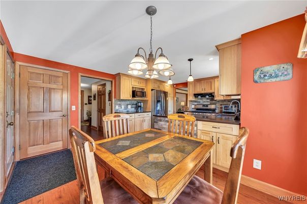 Chandelier, Dining room, Interior, Kitchen, Pendant Lights, Recessed Lighting, Stainless Steel Appliances, Wood Texture Flooring
