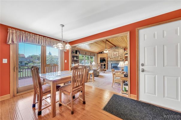 Dining room, Fireplace, Interior, Living room, Pendant Lights, Stone Walls, Wood Texture Flooring