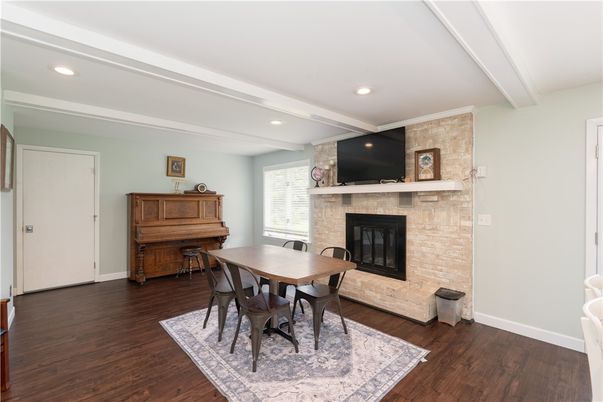 Dining room, Fireplace, Interior, Piano, Recessed Lighting, Wood Texture Flooring