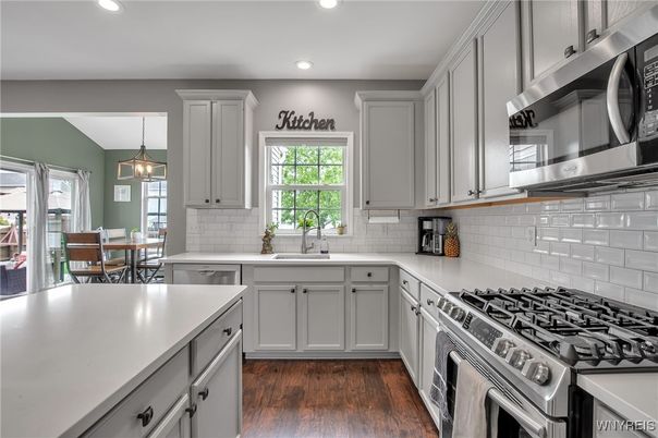 Dining room, Interior, Kitchen, Pendant Lights, Recessed Lighting, Stainless Steel Appliances, Wood Texture Flooring