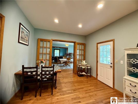 Dining room, Fireplace, Interior, Living room, Recessed Lighting, Wood Texture Flooring
