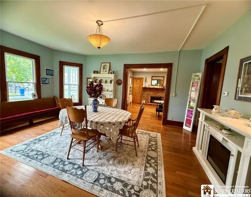 Dining room, Fireplace, Interior, Kitchen, Pendant Lights, Wood Texture Flooring