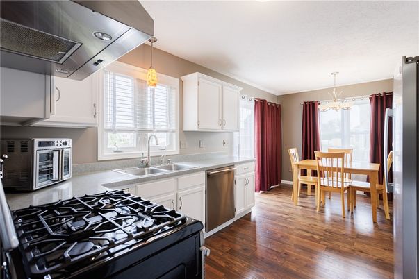 Dining room, Interior, Kitchen, Pendant Lights, Stainless Steel Appliances, Wood Texture Flooring