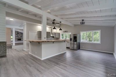 Empty room, Interior, Kitchen, Pendant Lights, Recessed Lighting, Stainless Steel Appliances, Wood Texture Flooring