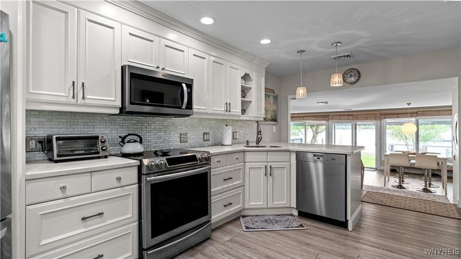 Dining room, Interior, Kitchen, Pendant Lights, Recessed Lighting, Stainless Steel Appliances, Wood Texture Flooring