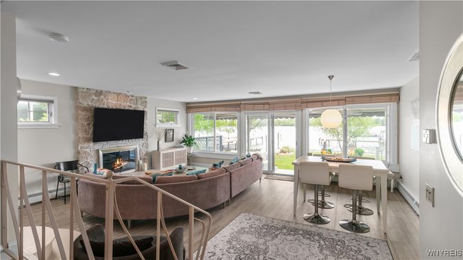 Dining room, Fireplace, Interior, Living room, Pendant Lights, Recessed Lighting, Stone Walls, Wood Texture Flooring